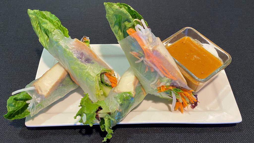 * Fresh Spring Rolls With Tofu * · Gluten free. Hand rolled in fresh rice paper wrapped with spring mix, red cabbage, romaine lettuce, carrots, cucumbers, mint, rice noodles, and bean sprouts. Served with our crafted peanut sauce (4 pcs).