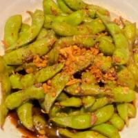 * Garlic Edamame * · Vegan. Sauteed edamame with our famous garlic chili soy sauce.