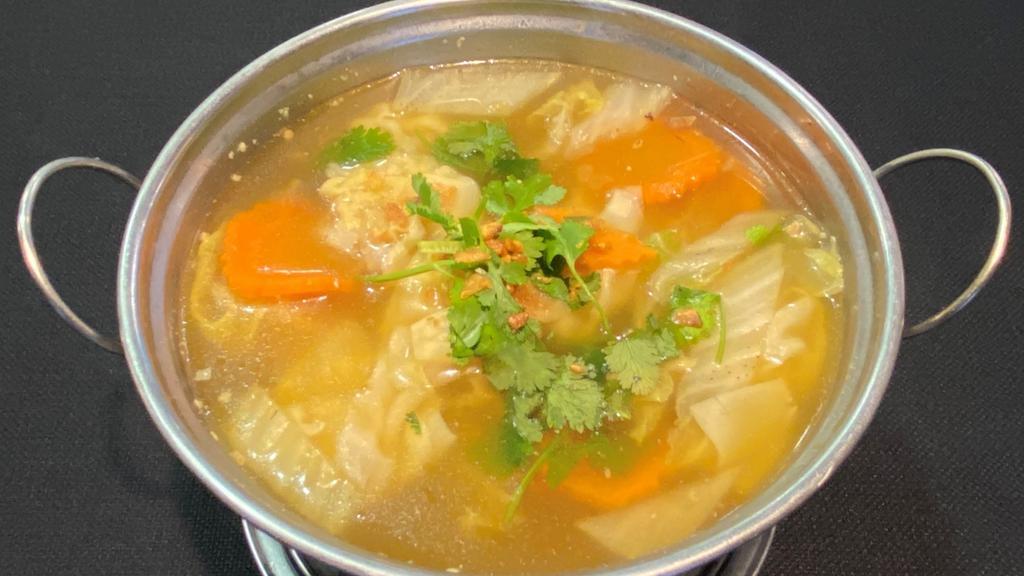 * Wonton Soup * · Spicy. Gluten free. Wontons stuffed with ground shrimp and pork, Napa cabbage, and cilantro.