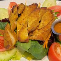 * Chicken Satay Salad * · Spicy. Marinated grilled chicken served with spring mix salad, red onions, cut  tomatoes, an...