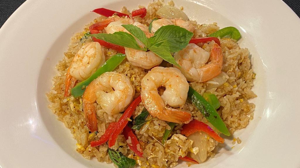 * Spicy Fried Rice * · With a chili-garlic paste, egg, bell peppers, onions, and fresh basil.