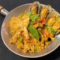 * Hor Mok Talay * · Spicy. Gluten free. Steamed seafood (calamari, fish, shrimp, green mussels) in red curry, eg...