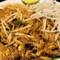 * L - Pad Thai * · Mild Spicy. Gluten free. Vegan. Thin rice noodles soft-fried in tamarind sauce with egg and ...