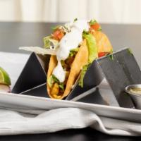 Crispy Taco · Your choice of meat served in a crispy shell topped with lettuce, pico de gallo, sour cream ...