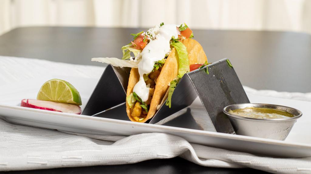 Crispy Taco · Your choice of meat served in a crispy shell topped with lettuce, pico de gallo, sour cream and cotija cheese.
