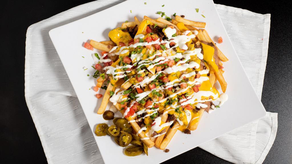 Super Fries · Fries served with nacho cheese, your choice of classic meat, beans, jalapenos, pico de gallo and sour cream