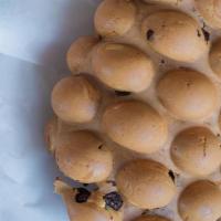 Chocolate Chip · Bubble waffle filled with chocolate chips throughout, drizzled with chocolate sauce.