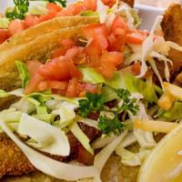 North Shore Fish Taco · Panko fried white fish served on corn tortillas, cabbage, tomato and our secret sauce.