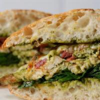 Grilled Chicken Pesto · Grilled chicken, melted provolone, fresh spinach, sun dried tomatoes, pesto, ciabatta.