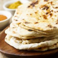 Naan · Fresh, puffy flatbread freshly baked to order.