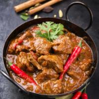 Chicken Madras · Chicken curry with a hint of heat, a la carte.