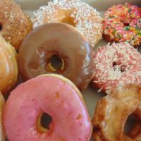 Regular Dozen · Six mixed glazed, four assorted cakes, and two old fashion donuts.