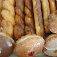 Medium Dozen · Four twists, three bars, three jelly donuts, and two buttermilk donuts.