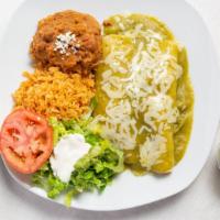 Enchiladas Plate · Two enchiladas made with corn tortillas, with meat with cheese inside and topped with red or...