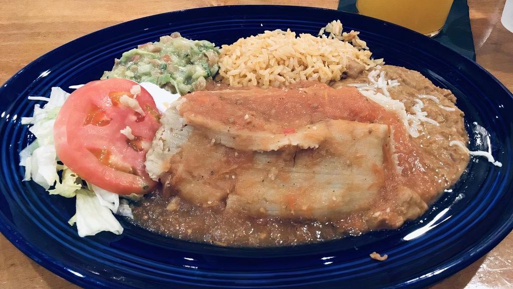 Pork Tamales Plate · Two pork tamales served with rice and beans.  **NO Tortillas**