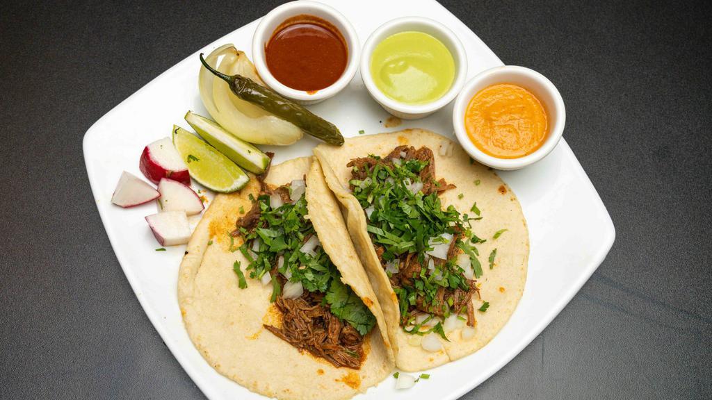 Street Tacos With Homemade Corn Tortilla · Street Tacos with Homemade corn tortilla
With your choice of Meat garnished with onion and cilantro and salsa.