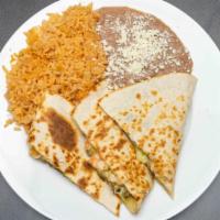 Super Quesadilla · Flour tortilla filled with cheese and your choice of meat  guacamole, sour cream, and our sp...