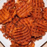 Sweet & Spicy Sweet Potato Waffle Fries · Spicy honey drizzle.