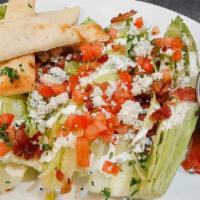 Romaine Wedge Salad · Romaine, bacon, tomato, crumbled bleu cheese, red onion, ranch dressing.