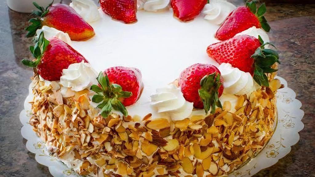 10’’ Round Strawberry Shortcake · Serves ten to thirteen people. White cake filled with fresh, glazed strawberries and whip cream. Decorated with whipped cream.