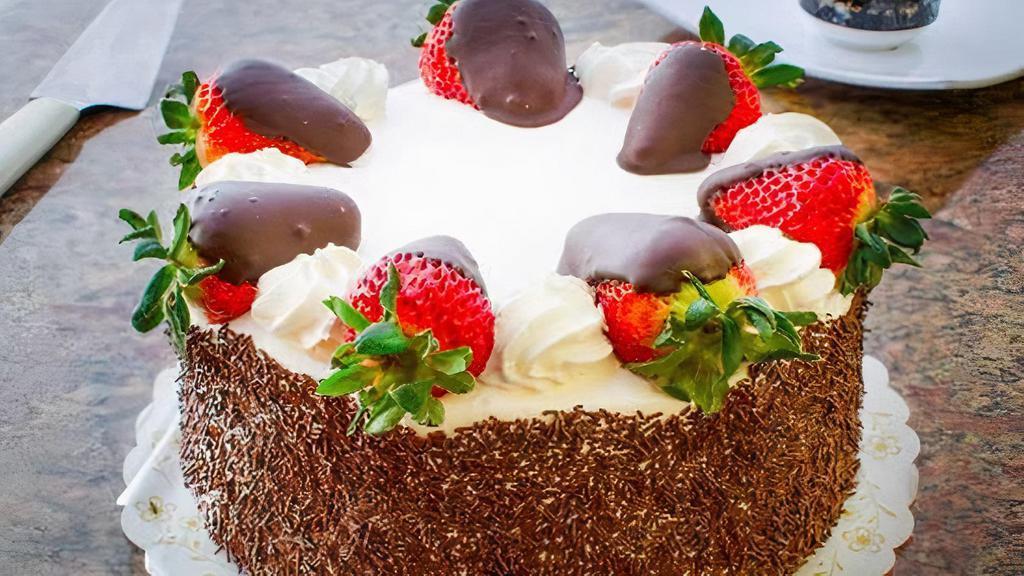 10’’ Round Chocolate Cake · Serves ten to thirteen people. Chocolate cake filled with fresh strawberries and chocolate mousse. Decorated with whipped cream.