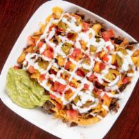 Asadas Fries · Any of our five meats with guacamole, cheese, tomato, jalapeños, cream with fries.