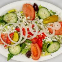 Greek Salad · Romaine lettuce, tomatoes, cucumbers, onions, kalamata olives, pepperoncini and feta cheese....