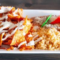 Chilaquiles · Red or Green Tortilla Chips, with 3 Eggs, Sour Cream and Cheese, served with Rice, Beans, an...