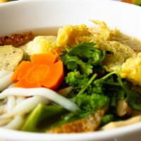 Vietnamese Udon Soup · Udon noodle, fried tofu skin, mushroom, carrot, daikon, tofu comes with fresh bean sprouts.