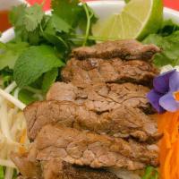 Vermicelli Noodle Salad With Garlic Beef  · Vermicelli noodles and shredded mixed vegetables tossed, topped with crushed peanut in our s...