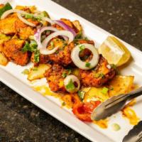 Malai Chicken Tikka · Boneless chicken breasts marinated overnight in a yogurt base w/ Indian spices & cooked in t...