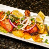 Chicken Tandoori · Quartered pieces of young succulent chicken, marinated overnight with special spices and her...