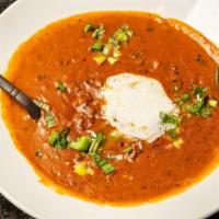 Dal Makhni · Slow-cooked Lentils made with garlic, ginger, Indian spices and served with butter.