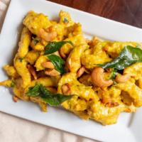 Navratan Korma · Items contain cashew or other tree nuts. Vegetables cooked with Indian spices with a creamy ...