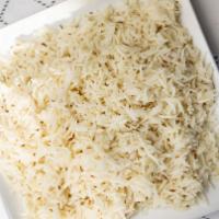 Basmati Rice · Fluffy Indian long grain rice boiled over slow heat with bay leaf, and cumin seeds.