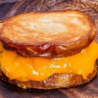 Grilled Cheese · Four slices of vegan American cheese grilled on an inside out pretzel bun.