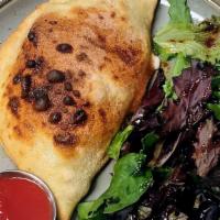 Napoli Veg Calzone · Over-baked folded pizza, house red sauce, house cheese blend, ricotta, eggplant, zucchini, o...