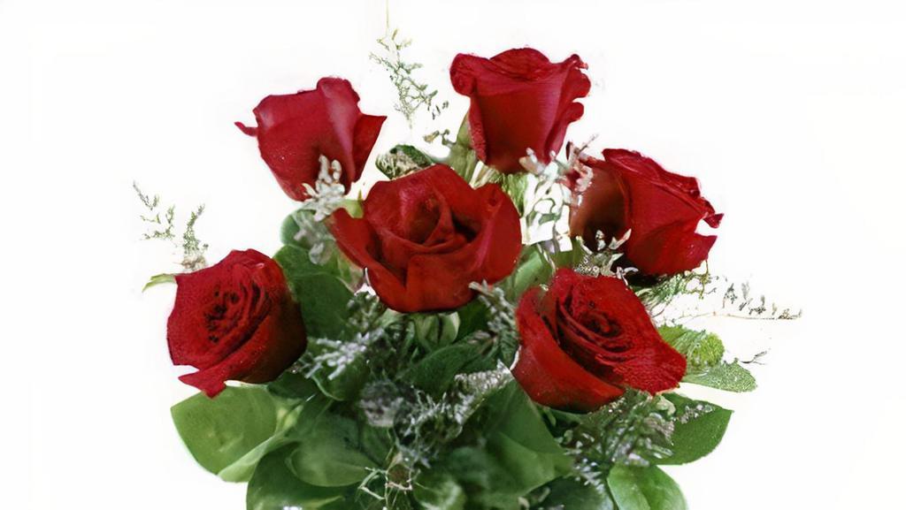 Half Dozen Red Roses Arrangement In Clear Vase · Half a dozen red roses arrangement in clear vase.
***ENTER CARD MESSAGE UNDER SPECAIL INTRUCTION, PLEASE INDICATE SENDER AND RECEIVER NAME. ***
NOTE:  All selections shown are representative of the arrangements that we can prepare for you, however due to flower availability and seasonal variations we may not be able to fill your order exactly as illustrated. Your order will be filled to the specified amount with products of an equal or greater value.  As Flower are sensitive items, the size, shade, bloom, and color might difference from the image shown.