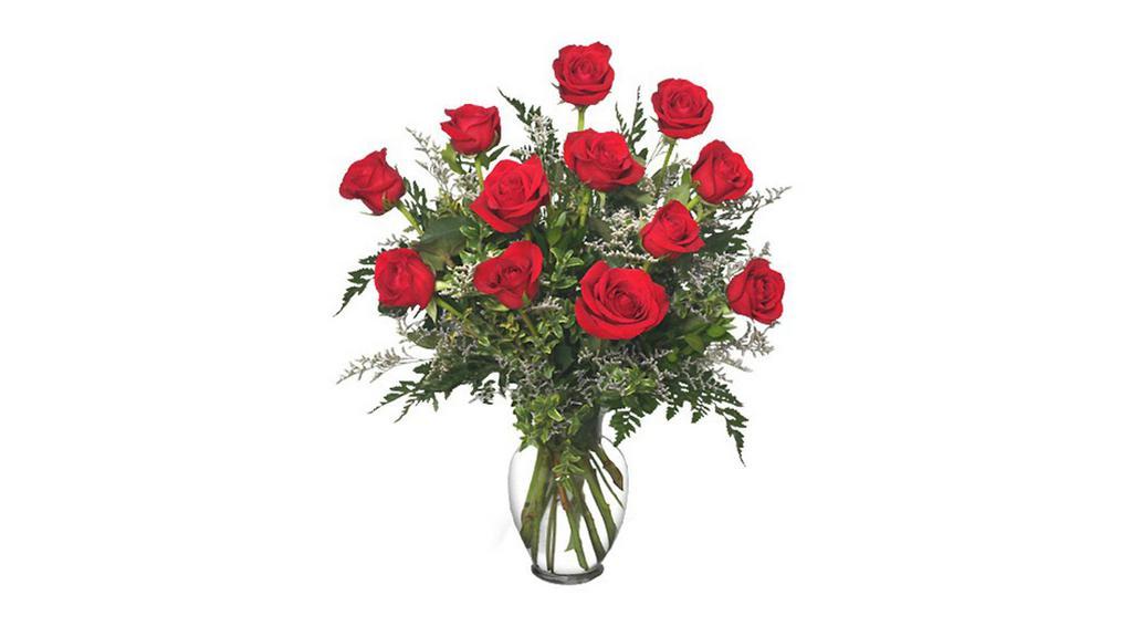 One Dozen Red Roses Arrangement In Clear Vase    · One dozen premium roses arranged in a clear vase with greens and Mist or Baby's Breath accent flowers.
***ENTER CARD MESSAGE UNDER SPECAIL INTRUCTION, PLEASE INDICATE SENDER AND RECEIVER NAME. *** 
NOTE:   All selections shown are representative of the arrangements that we can prepare for you, however due to flower availability and seasonal variations we may not be able to fill your order exactly as illustrated. Your order will be filled to the specified amount with products of an equal or greater value.  As Flower are sensitive items, the size, shade, bloom, and color might difference from the image shown.