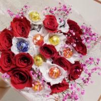 Dozen  Fragrant Red Roses & Chocolates Bouquet  · Lovely design featuring fresh fragrant dozen red Roses, fillers and 10 assorted Lindt Lindor...