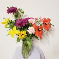 Pastel Grace And Wonder · A lovely arrangement of dark pastel flowers including Chrysanthemum, Freesia, Alstroemeria, ...