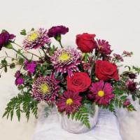 Fuchsia Passion · Enjoy this gorgeous arrangement filled with dark red Roses, Fuchsia Carnation, Daisy, Chrysa...