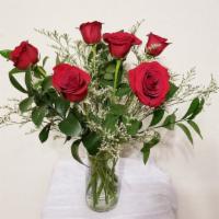 Half A Dozen Red Roses Arrangement · Half a dozen red roses with filler and greenery arrangement in clear vase.

NOTE:   All sele...