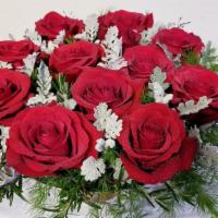 Modern Romance · A romantic design featuring fresh dozen red roses, accented with Dusty Miller, Jasmin vine, ...