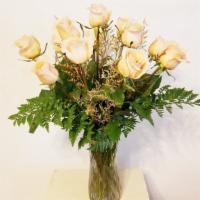Dozen Shimmer Roses · Gorgeous apricot shimmer roses dance amongst the earthy mixture of foliage in the tall glass...