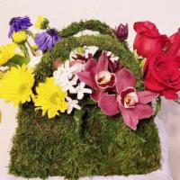 Purse Of Happiness – Perfect Gift · Purse Of Happiness features a mossed “purse” tucked overflowing with the sweetest red Roses,...
