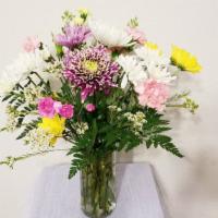 Fresh Cut Mixed Floral Arrangement  In Clear Vase · An array of fresh cut flowers of the season arranged in clear vases.
***ENTER CARD MESSAGE U...