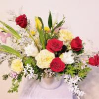 100% Designer Choice Multi-Color Arrangement · Bring thoughts of joy and excitement to your loved one with this multi-colored extravaganza,...