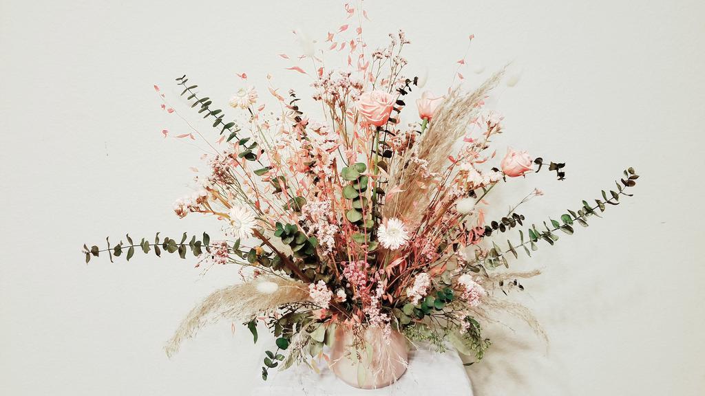 Pretty In Pink - Preserved & Dried Flowers Arrangement · We have these timeless flowers that give the perfect, effortless, boho look for any space pink preserved Roses, Statice, Misty, Straw flowers, Bunny Tails, Baby Blue Eucalyptus, Seed Eucalyptus, and Wild Oats.  Dried Flowers last a long time (up to 3 or more years) since they are processed to have a live look. The perfect flower gift for a special occasion or loved one. 

*** Flower Care: 
•	Your dried flowers should be stored in a cool dry place, away from direct sunlight to prevent discoloration or fading. 
•	If your dried flower becomes dusty, use a hair dryer on a low setting from a moderate distance or a pipe cleaner to gently remove the dust.