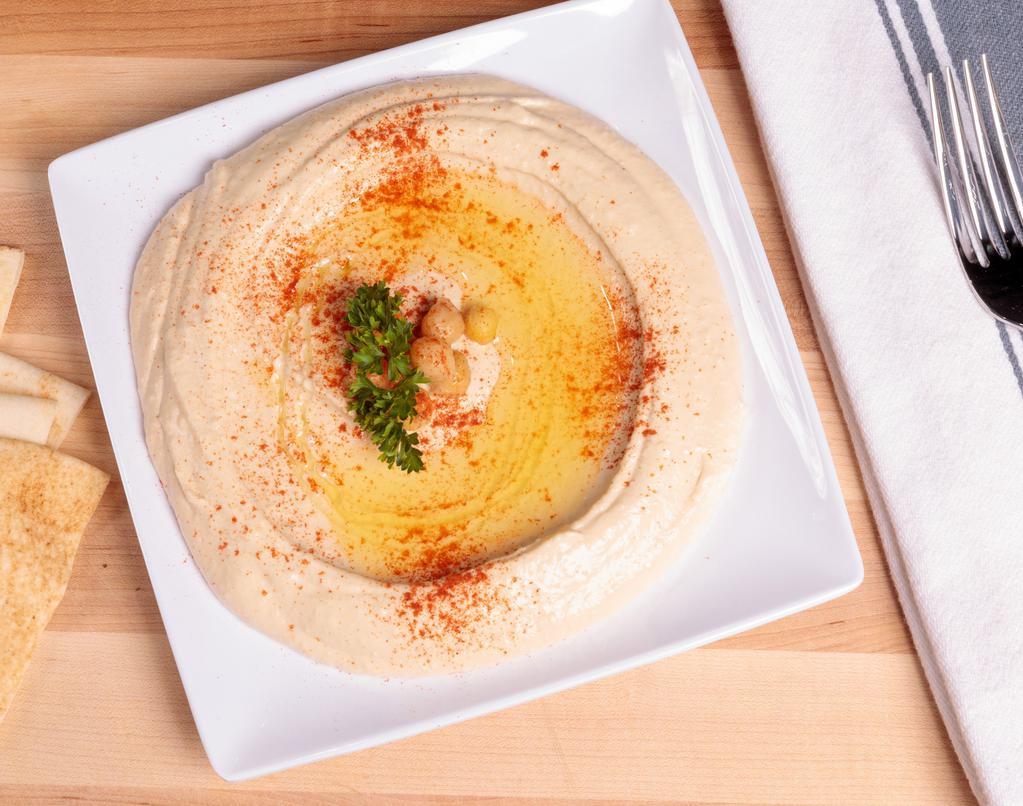 Pita & Hummus · Garbanzo beans blended with garlic, lemon juice, tahini and extra virgin olive oil. Served with pita bread.